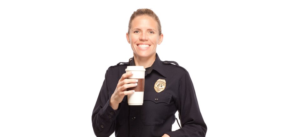 Female police officer with disposable cup